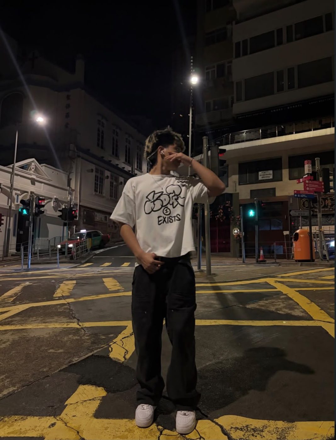 Drop 0 tee worn on a Hong Kong street at night, front print